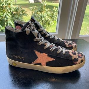 Golden Goose Black and Cheetah high top sneaker.